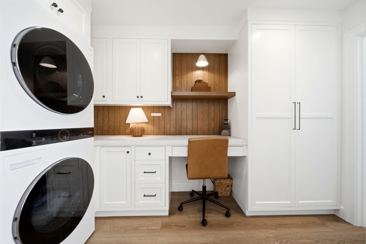 The built-in desk nook beside the in-residence laundry