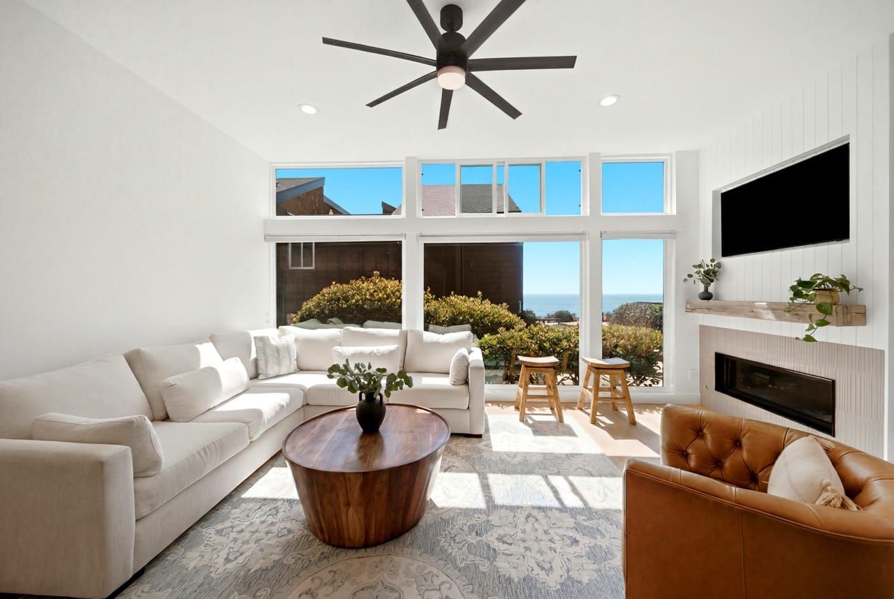 The vaulted living room with its fireplace and built-in window seat