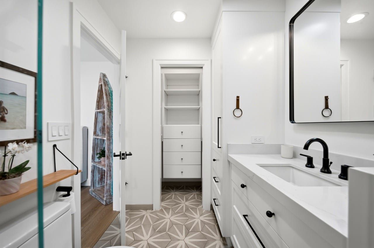The second bathroom vanity, with its walk-in closet beyond