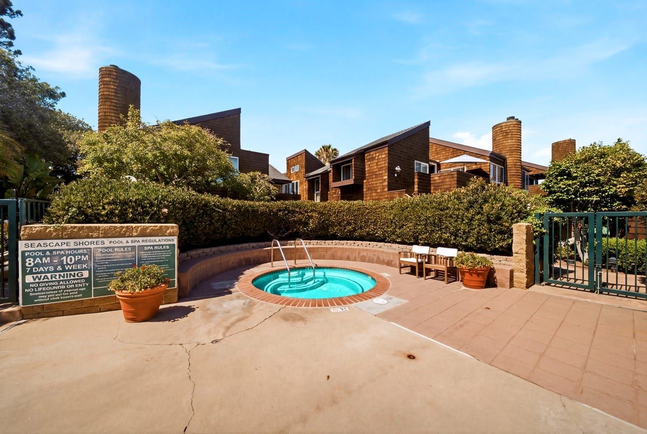 The community spa beside the pool deck